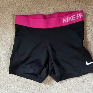 Black Nike pro spandex size small with hot pink waist band.